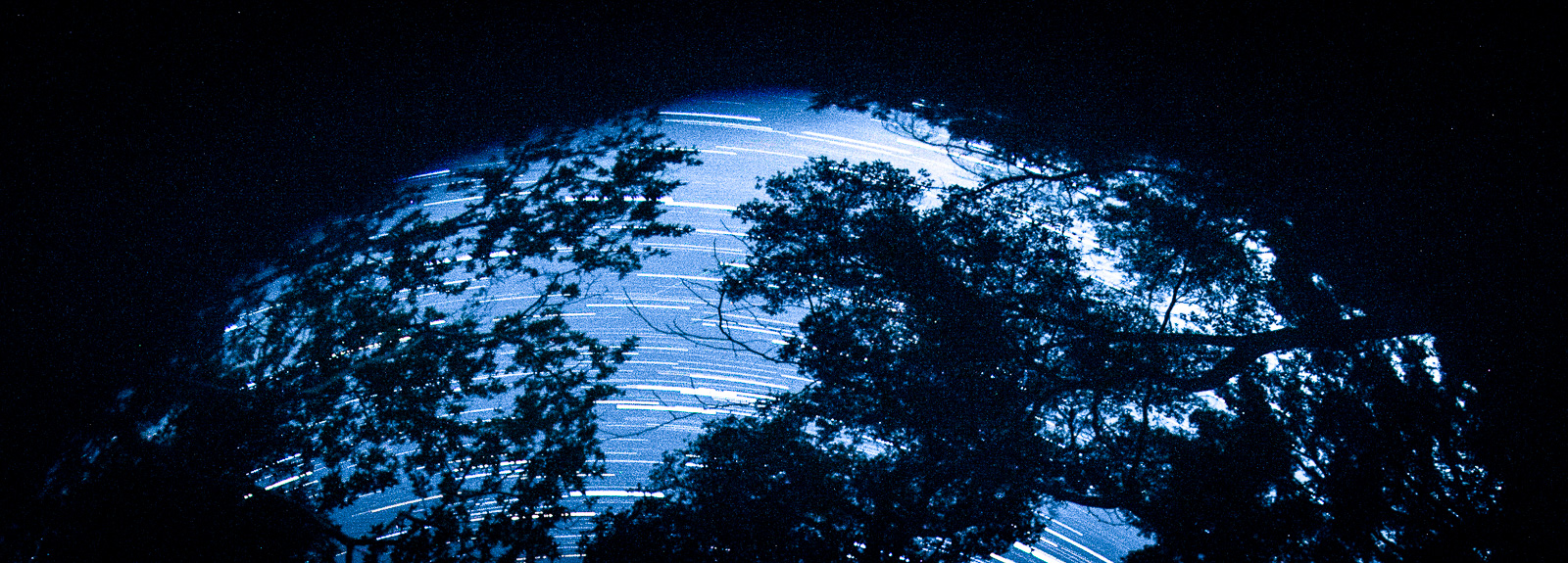 setting earth, like a setting sun, buit a star trailed type o thing